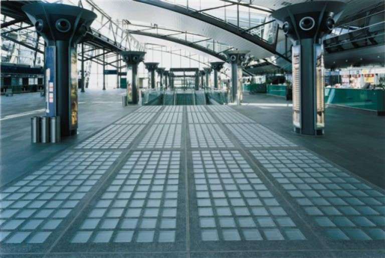 Structural glass pavers installed across a public floor